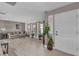 Bright living room featuring tile floors, neutral decor, and a welcoming front entry at 1585 Randolph St, Deltona, FL 32725