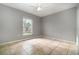 Bedroom featuring neutral walls, tile flooring, a ceiling fan, and a window overlooking the backyard at 1967 Villa Angelo Blvd, St Cloud, FL 34769