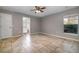 Spacious bedroom featuring tile flooring, neutral walls, and a ceiling fan, offering a comfortable retreat at 1967 Villa Angelo Blvd, St Cloud, FL 34769
