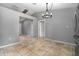 Bright dining area with tiled floors, a modern light fixture, and easy access to other rooms at 1967 Villa Angelo Blvd, St Cloud, FL 34769
