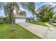 Charming single-story home featuring a well-manicured lawn, a one car garage, and a welcoming entrance at 1967 Villa Angelo Blvd, St Cloud, FL 34769