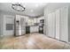 Well-lit kitchen featuring stainless steel appliances, white cabinets, and tile floors for a modern, clean look at 1967 Villa Angelo Blvd, St Cloud, FL 34769