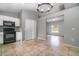 Bright kitchen featuring tiled floors, and modern appliances, seamlessly connecting to the living area at 1967 Villa Angelo Blvd, St Cloud, FL 34769