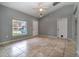 Bright living room featuring tile flooring, neutral walls, and a large window, creating a welcoming space at 1967 Villa Angelo Blvd, St Cloud, FL 34769