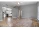 Open-concept living room showcasing tile flooring and access to the kitchen, enhancing the home's appeal at 1967 Villa Angelo Blvd, St Cloud, FL 34769