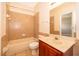 Cozy bathroom featuring a shower-tub combo, tile floors, and a single sink vanity at 2260 The Oaks Blvd, Kissimmee, FL 34746