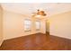 Comfortable bedroom with a ceiling fan, windows, and a closet, offering a relaxing retreat at 2260 The Oaks Blvd, Kissimmee, FL 34746