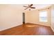 Inviting bedroom featuring wood flooring, a ceiling fan, natural light, and a convenient closet at 2260 The Oaks Blvd, Kissimmee, FL 34746