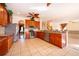 Spacious kitchen with stainless steel appliances, granite countertops, and tile flooring perfect for cooking at 2260 The Oaks Blvd, Kissimmee, FL 34746