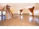 Bright and airy living room featuring tile floors, staircase and natural light, perfect for entertaining at 2260 The Oaks Blvd, Kissimmee, FL 34746