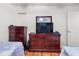 Functional bedroom with two twin beds, wooden dresser, and ample natural light at 2478 Pillar Coral Dr # S, Orlando, FL 32808