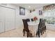 Bright dining room with tile floors, table with seating for six, and ample storage at 2478 Pillar Coral Dr # S, Orlando, FL 32808