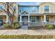 Inviting townhome featuring a covered front porch and colorful exterior paint scheme at 2478 Pillar Coral Dr # S, Orlando, FL 32808