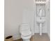 Bright bathroom with a pedestal sink, white toilet, and tiled flooring at 260 S Osceola Ave # 601, Orlando, FL 32801