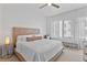 Bright bedroom featuring a well-lit room with a large bed and a large window with curtains at 260 S Osceola Ave # 601, Orlando, FL 32801