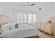 Bright bedroom with a neutral palette, large windows, ceiling fan, and a light wood dresser at 260 S Osceola Ave # 601, Orlando, FL 32801