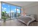 Bright bedroom with floor-to-ceiling windows offering city views and modern decor at 260 S Osceola Ave # 601, Orlando, FL 32801