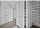 Walk-in closet with built-in shelving and ample storage space at 260 S Osceola Ave # 601, Orlando, FL 32801