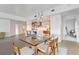Contemporary dining area with glass-top table, modern lighting, and access to living and kitchen at 260 S Osceola Ave # 601, Orlando, FL 32801