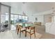 Dining area with a glass table and large windows offering natural light and scenic views at 260 S Osceola Ave # 601, Orlando, FL 32801