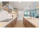 Sleek, modern kitchen with stainless steel appliances, quartz countertops and contemporary lighting at 260 S Osceola Ave # 601, Orlando, FL 32801