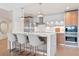 Contemporary kitchen featuring a marble breakfast bar, stainless steel appliances, and modern cabinetry at 260 S Osceola Ave # 601, Orlando, FL 32801