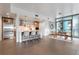 Open-concept living area with kitchen featuring a breakfast bar, stainless appliances, and dining area at 260 S Osceola Ave # 601, Orlando, FL 32801