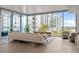 Bright living room with floor-to-ceiling windows and a large, comfortable white sofa at 260 S Osceola Ave # 601, Orlando, FL 32801