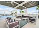 Relax in this stylish rooftop lounge by the pool, featuring comfortable seating and elegant decor at 260 S Osceola Ave # 601, Orlando, FL 32801