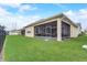 Property boasts a screened-in lanai and a well-maintained yard at 2741 Southland St, St Cloud, FL 34772