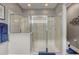 Walk-in shower features glass doors, tiled walls, and modern fixtures at 2741 Southland St, St Cloud, FL 34772