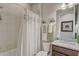 Bathroom featuring a shower with white curtain, vanity with granite countertop, and decorative towels at 2741 Southland St, St Cloud, FL 34772