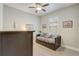 Cozy bedroom featuring a daybed with storage drawers, soft lighting, and window shutters at 2741 Southland St, St Cloud, FL 34772