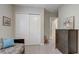 Bright bedroom with closet and wood dresser featuring a cozy bed with blue pillows at 2741 Southland St, St Cloud, FL 34772