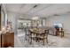 Bright dining area with stylish furnishings, a modern chandelier, and easy access to the patio at 2741 Southland St, St Cloud, FL 34772