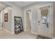 Inviting entryway with decorative shelving, modern lighting, and clear view of the front door at 2741 Southland St, St Cloud, FL 34772