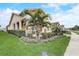 Beautiful home with a landscaped lawn and a cozy front porch area with rocking chairs at 2741 Southland St, St Cloud, FL 34772