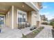 Inviting front porch with rocking chairs, stone accents, and landscaped walkway at 2741 Southland St, St Cloud, FL 34772