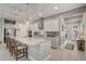 Modern kitchen with a large center island, stainless steel appliances, and sleek white cabinetry at 2741 Southland St, St Cloud, FL 34772