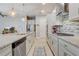 Spacious kitchen features an island with seating, stainless steel appliances, and ample storage at 2741 Southland St, St Cloud, FL 34772