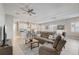 Open-concept living room with modern furnishings, a ceiling fan, and lots of natural light at 2741 Southland St, St Cloud, FL 34772