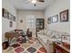 Cozy office space featuring a large desk, comfortable sofa, and patterned area rug at 2741 Southland St, St Cloud, FL 34772