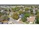 Home's aerial view showcasing solar panels, mature trees, and well-maintained landscaping in a residential neighborhood at 2856 Broward Ct, Oviedo, FL 32765