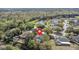 Aerial view of home with solar panels, screened-in pool, and mature landscaping in a quiet neighborhood at 2856 Broward Ct, Oviedo, FL 32765