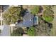 Aerial view of home with solar panels, screened-in pool, and well-maintained landscaping at 2856 Broward Ct, Oviedo, FL 32765