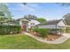 Lovely single-story home with lush landscaping, a well-kept lawn, and inviting curb appeal at 2856 Broward Ct, Oviedo, FL 32765