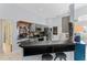 Functional kitchen with a breakfast bar and gray cabinetry at 2856 Broward Ct, Oviedo, FL 32765
