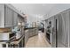Bright kitchen with stainless steel appliances and breakfast bar at 2856 Broward Ct, Oviedo, FL 32765