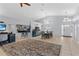 Spacious living area with tile floors, high ceilings, and a seamless flow to the dining area at 2856 Broward Ct, Oviedo, FL 32765