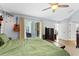 Relaxing bedroom with a ceiling fan and patio access at 2856 Broward Ct, Oviedo, FL 32765